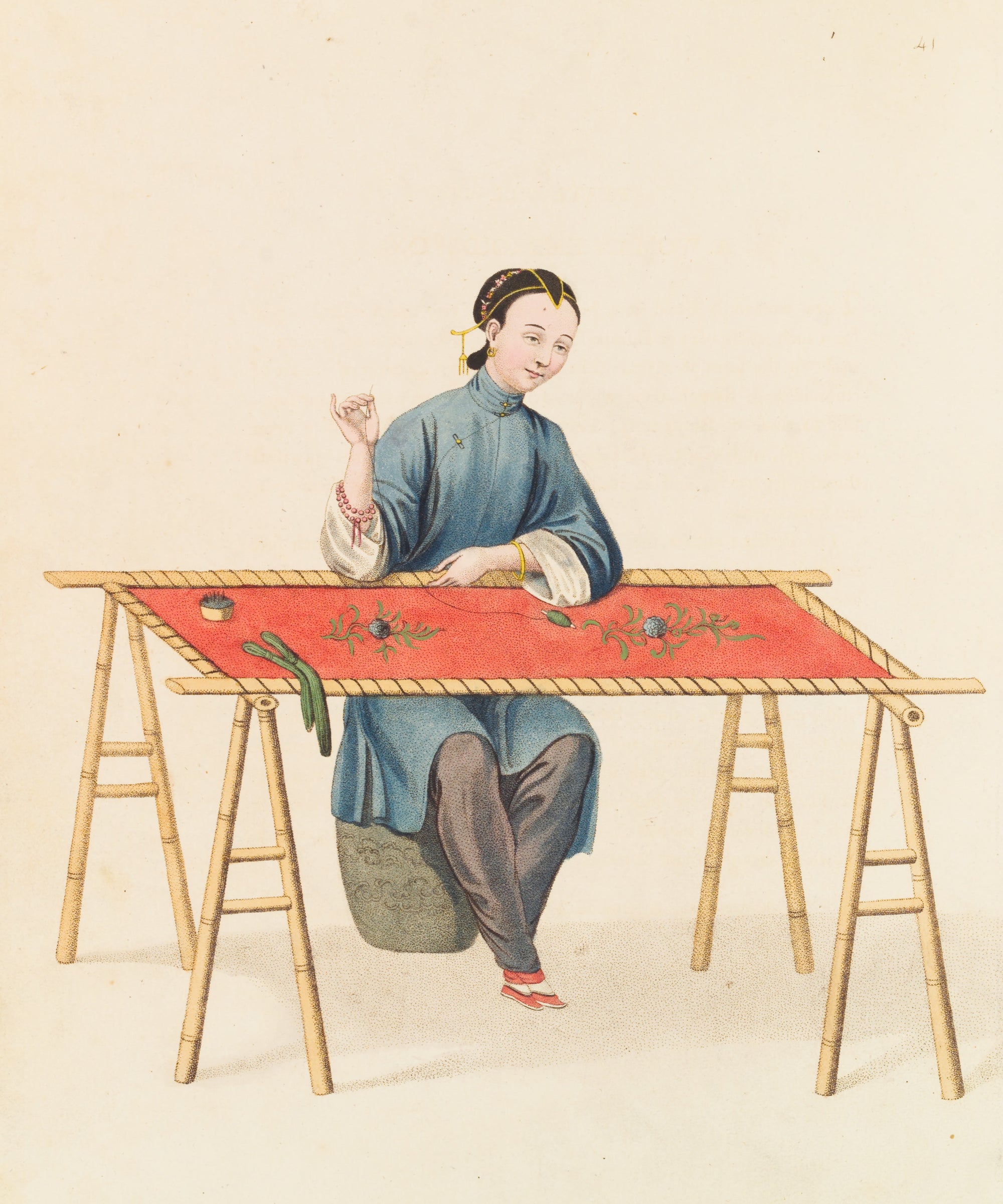 Woman embroidery at a table, sewing flowers by hand
